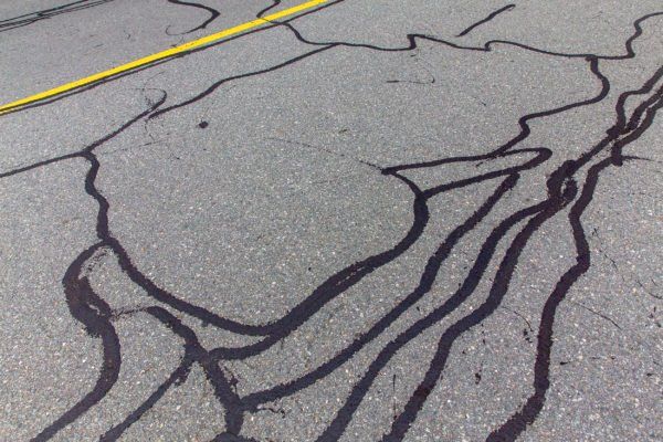 The cracks in this pavement are sealed to extend its life and avoid future costly repairs.